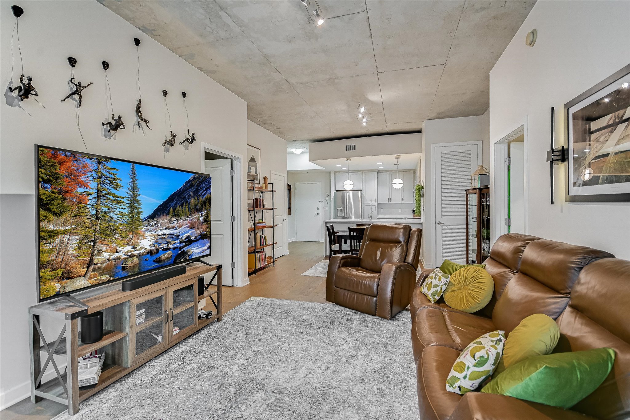 360 Nueces Street, Unit 1405 Austin, TX 78701 - Photo 25 of 40 a living room with furniture and a flat screen tv