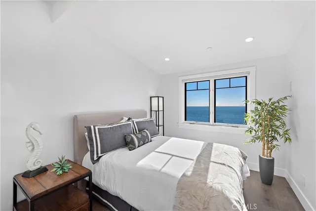 a view of a terrace with furniture and a garden