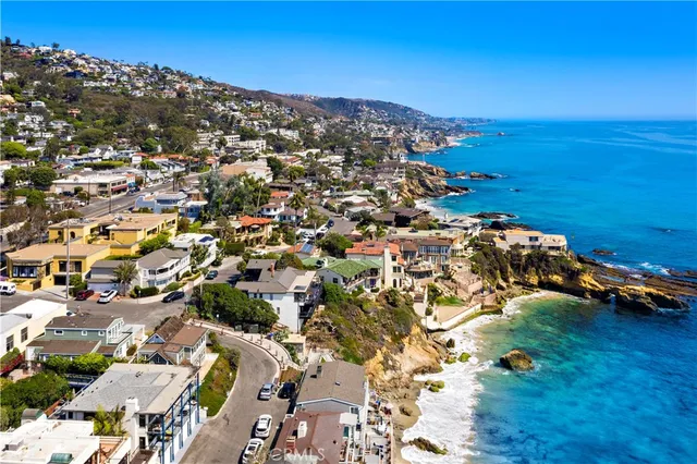 a aerial view of a brick building next to a yard