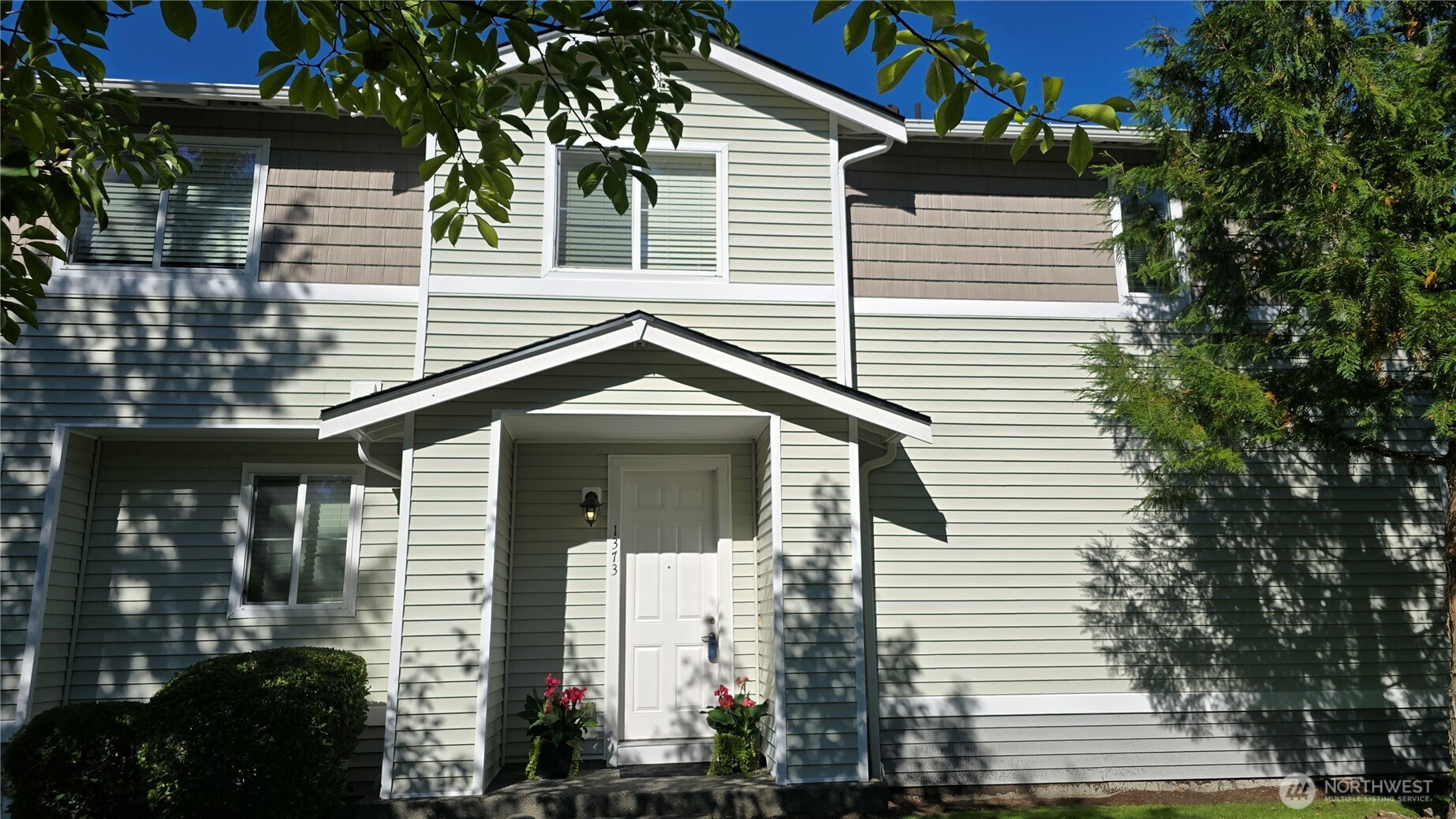 1373 Hudson Street DuPont, WA 98327 - Photo 2 of 12 a front view of a house with a yard