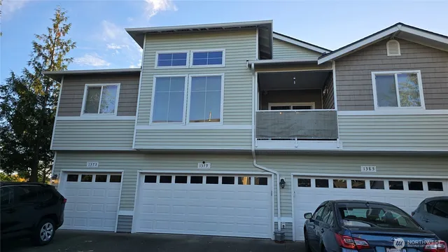 a view of a car park in front of house