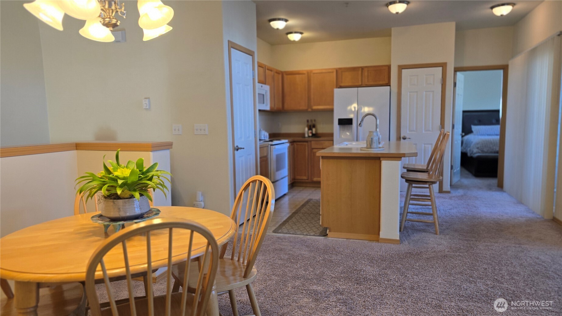 1373 Hudson Street DuPont, WA 98327 - Photo 8 of 12 a view of a dining room with furniture and a chandelier