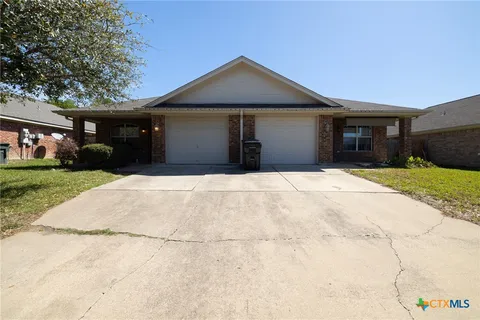a front view of house with yard and seating area