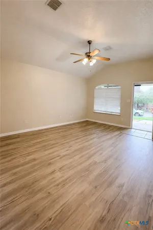 a kitchen with granite countertop a stove a microwave and a sink