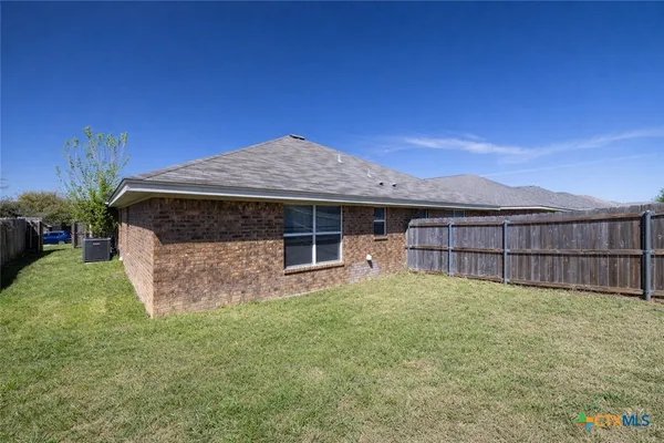 a front view of a house with yard