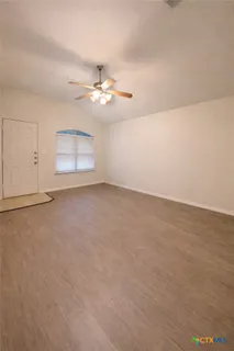 a kitchen with appliances and cabinets