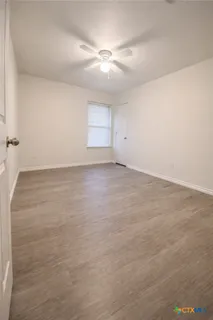 a bathroom with a sink double vanity granite tub and shower