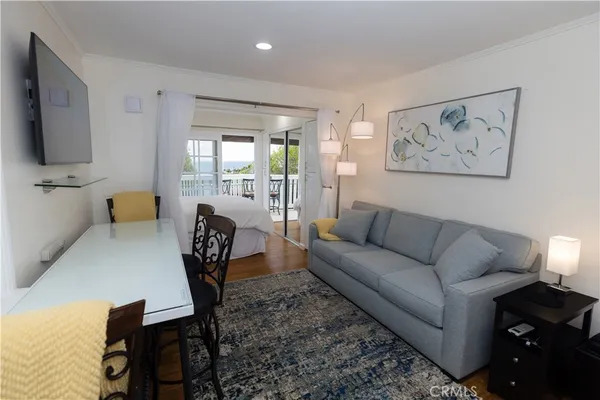 a bedroom with a large bed and a large window
