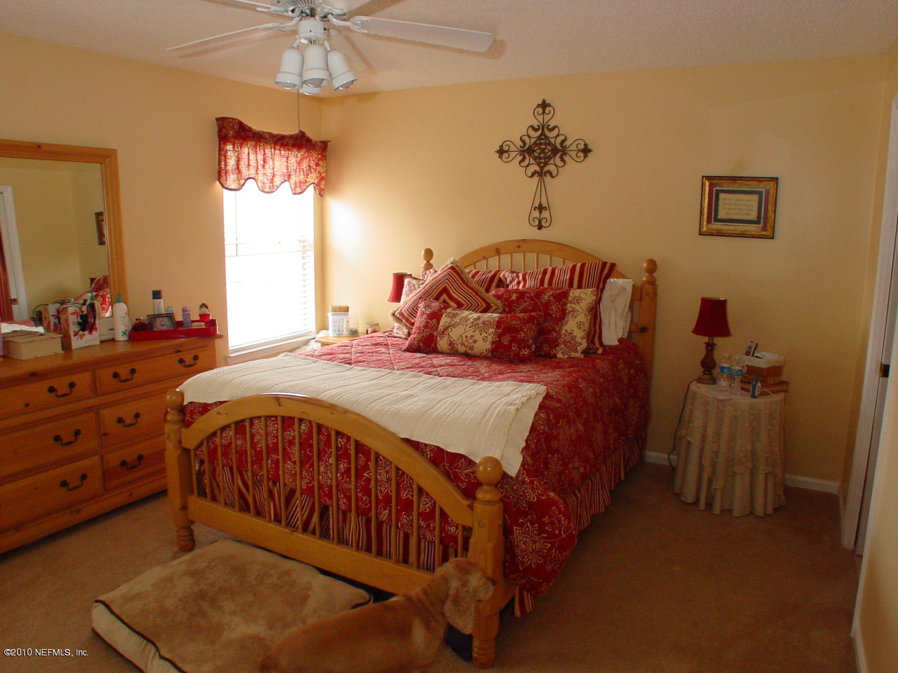8774 E Spring Jacksonville, FL 32244 - Photo 2 of 8 a bed sitting in a bedroom next to a window