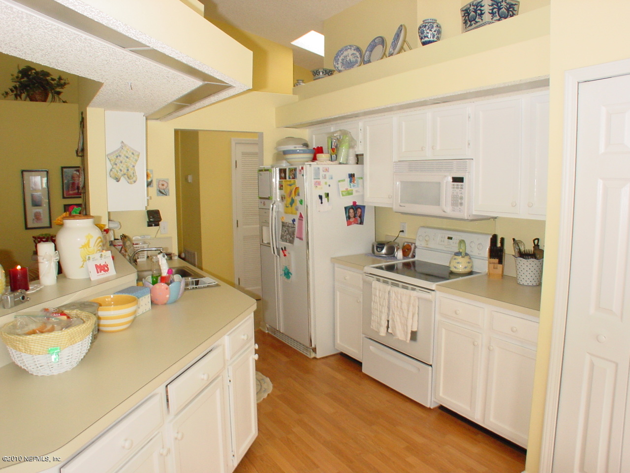 8774 E Spring Jacksonville, FL 32244 - Photo 3 of 8 a kitchen with a sink stove and refrigerator