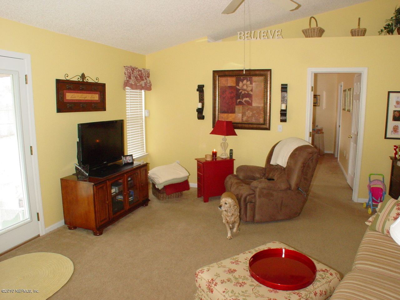8774 E Spring Jacksonville, FL 32244 - Photo 4 of 8 a living room with furniture and a flat screen tv