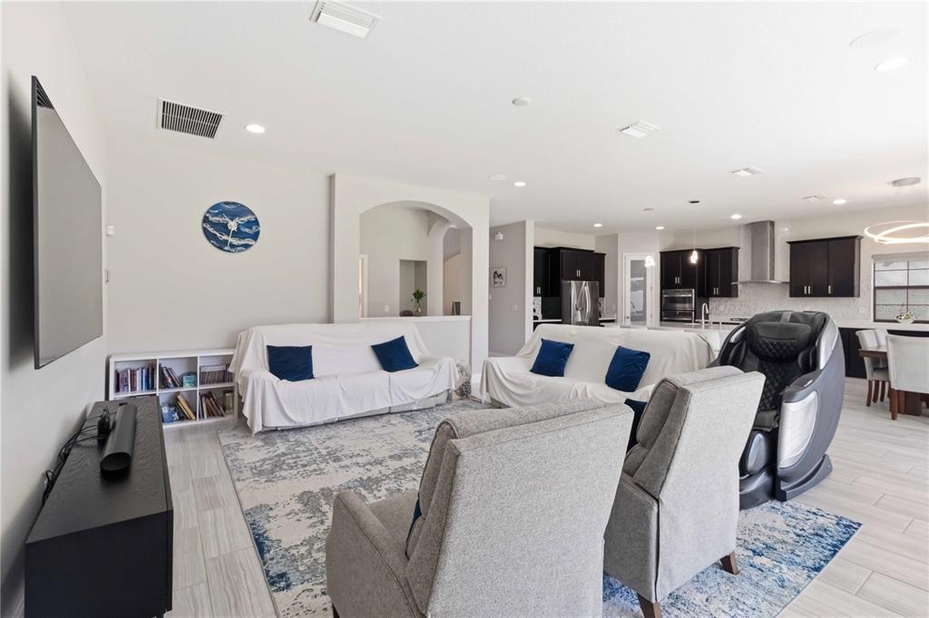 805 Viscount Street Brandon, FL 33511 - Photo 11 of 46 a living room with furniture and a flat screen tv