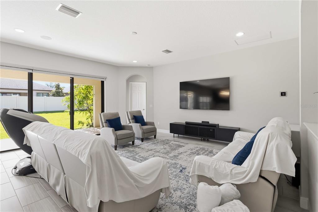805 Viscount Street Brandon, FL 33511 - Photo 12 of 46 a living room with furniture and a flat screen tv