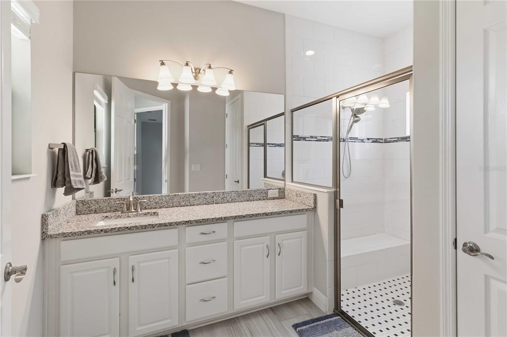 805 Viscount Street Brandon, FL 33511 - Photo 19 of 46 a bathroom with a double vanity sink and a mirror