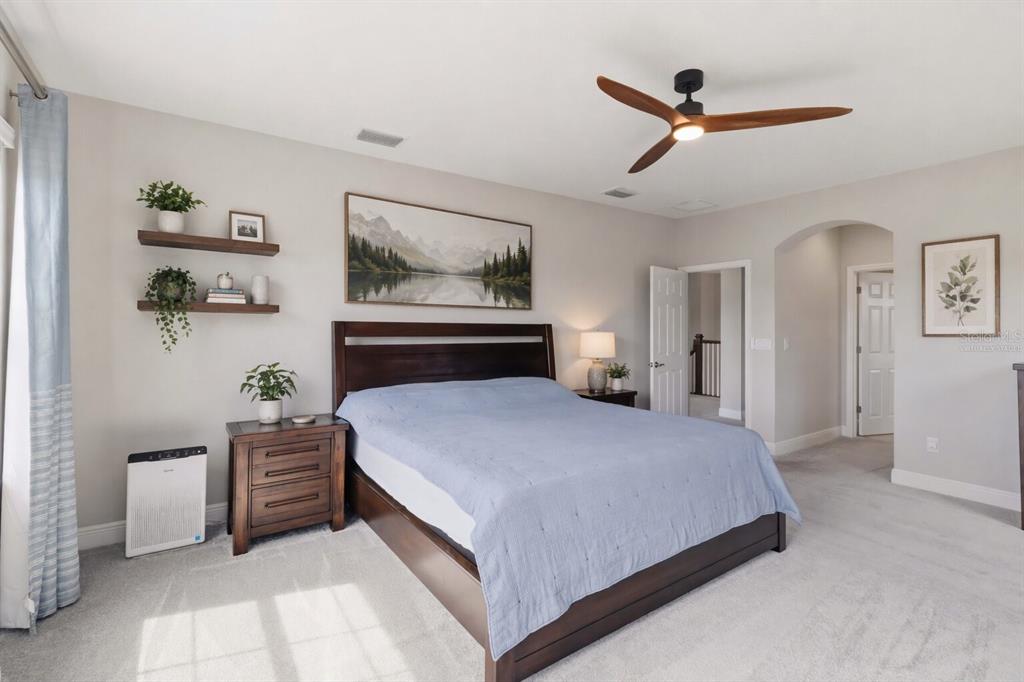 805 Viscount Street Brandon, FL 33511 - Photo 23 of 46 a bedroom with a bed and a painting on the wall