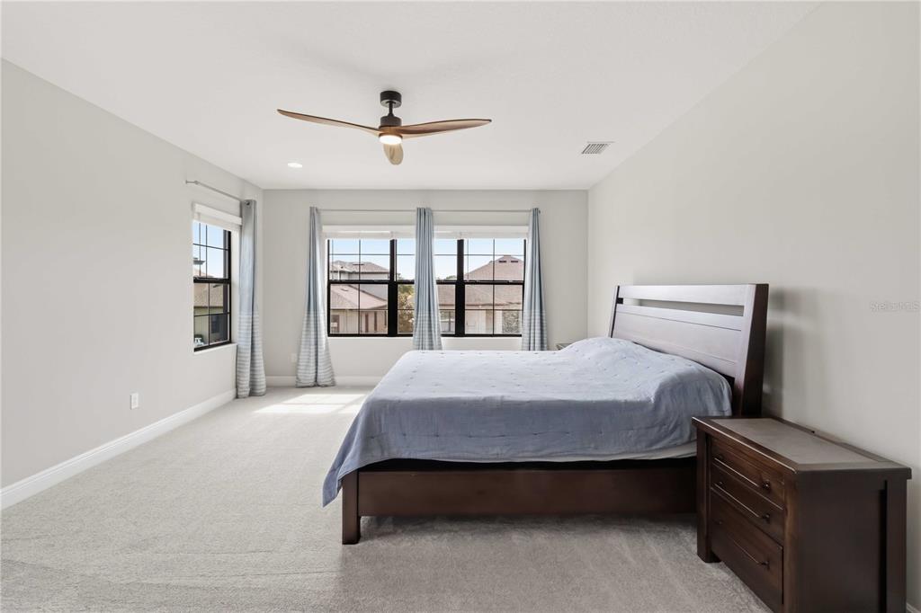 805 Viscount Street Brandon, FL 33511 - Photo 25 of 46 a bedroom with a bed and a large window