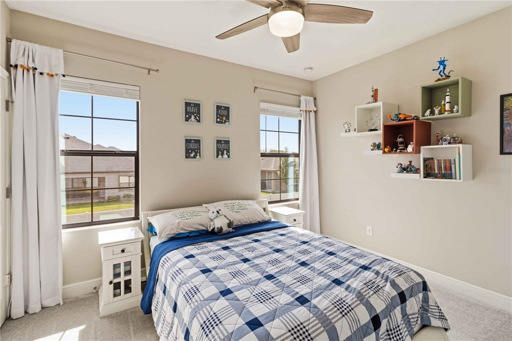 805 Viscount Street Brandon, FL 33511 - Photo 29 of 46 a bedroom with a large bed and a window