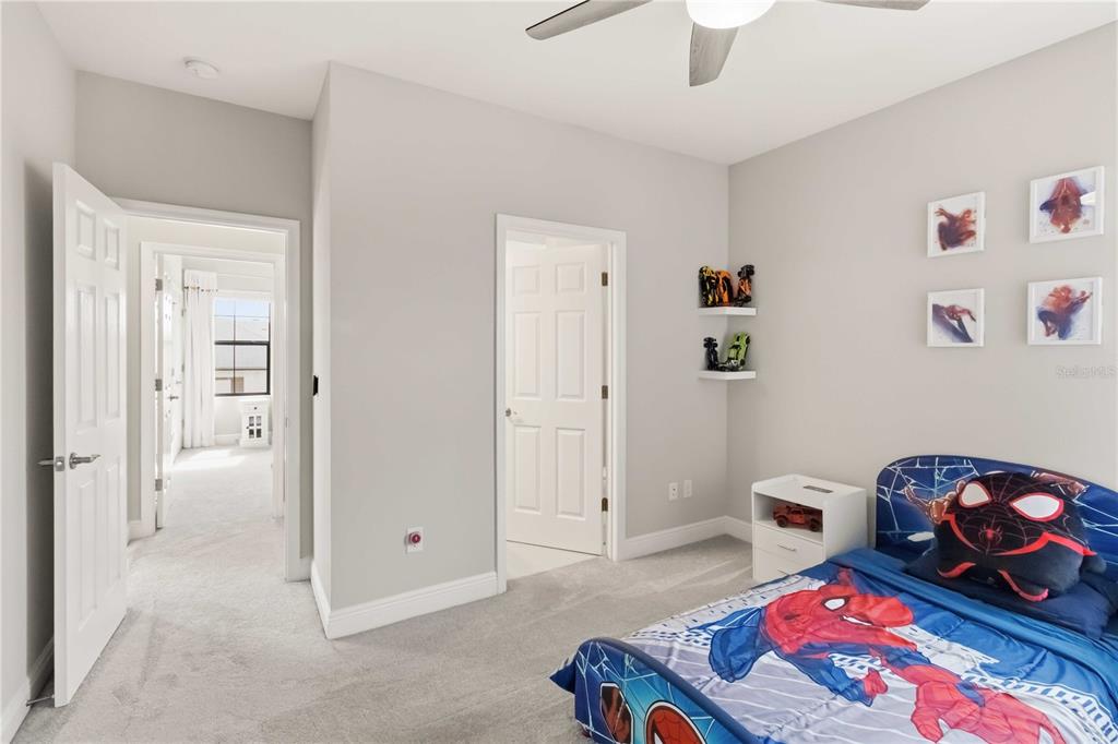 805 Viscount Street Brandon, FL 33511 - Photo 31 of 46 a bedroom with a bed and a dresser