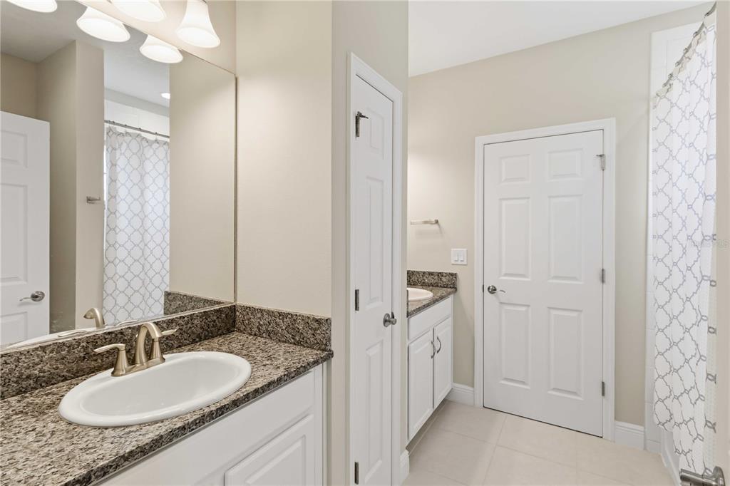 805 Viscount Street Brandon, FL 33511 - Photo 32 of 46 a bathroom with a granite countertop sink and a mirror