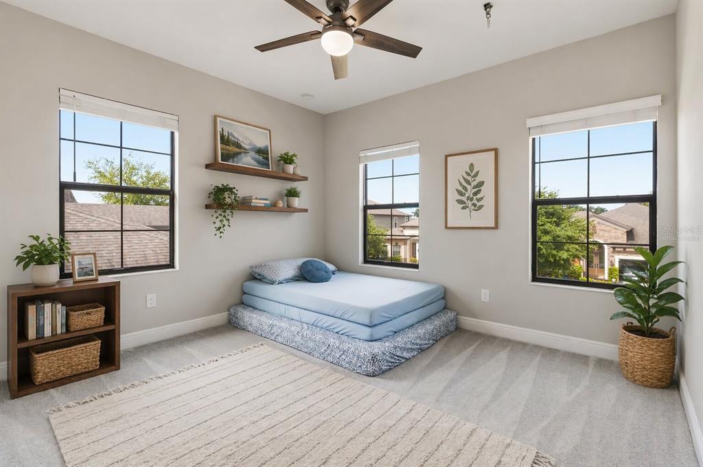 805 Viscount Street Brandon, FL 33511 - Photo 34 of 46 a spacious bedroom with a large bed and a window
