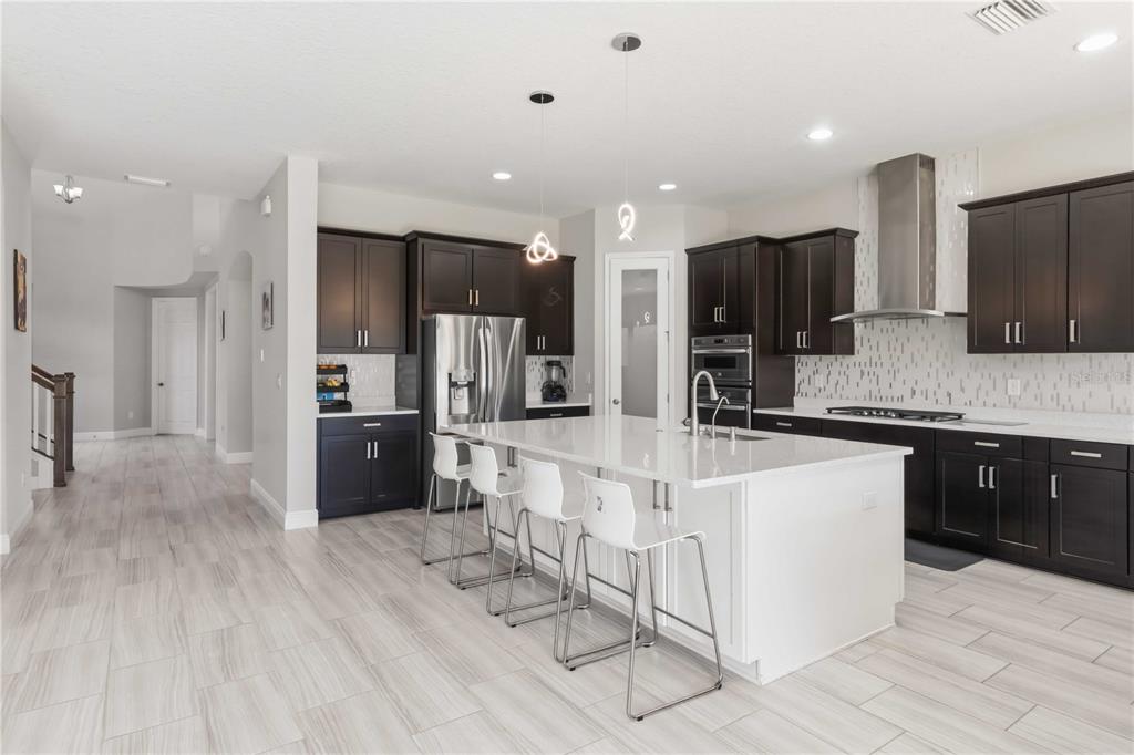 805 Viscount Street Brandon, FL 33511 - Photo 5 of 46 a large white kitchen with a large window and stainless steel appliances
