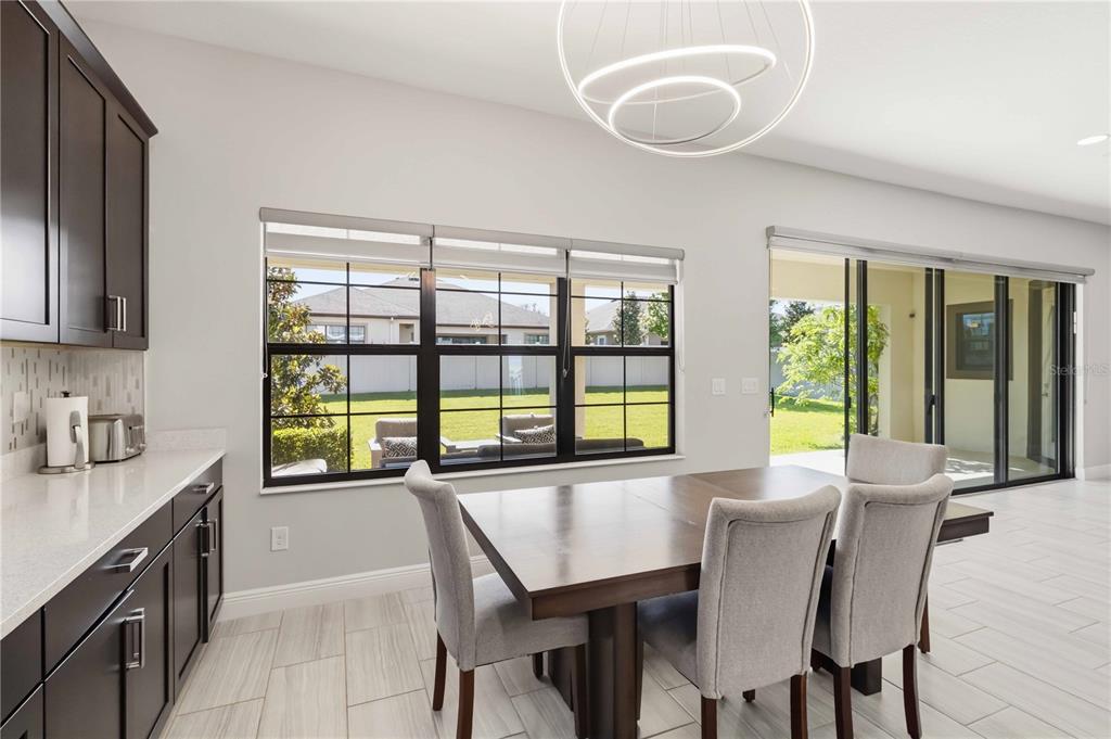 805 Viscount Street Brandon, FL 33511 - Photo 8 of 46 a view of a dining room with furniture window and outside view