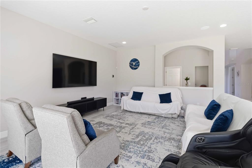 805 Viscount Street Brandon, FL 33511 - Photo 10 of 46 a living room with furniture and a flat screen tv