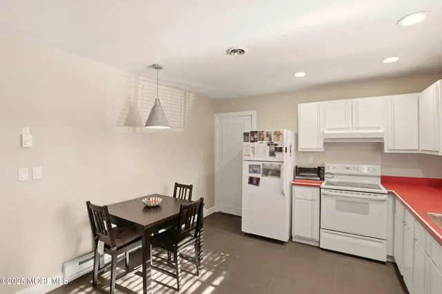 a kitchen with cabinets and appliances