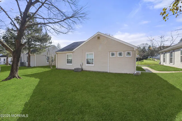 a view of a backyard of the house