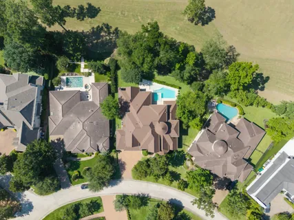 an aerial view of a house with outdoor space and street view