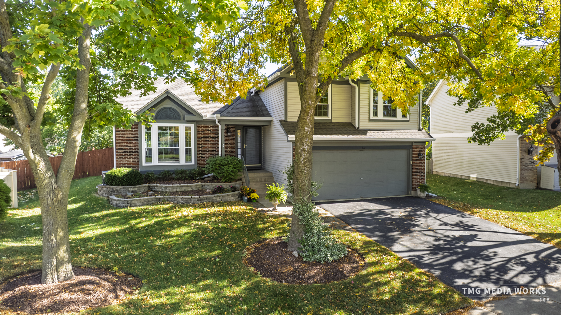 300 Churchill Lane Aurora, IL 60504 - Photo 1 of 30 a view of a house with a yard and large tree