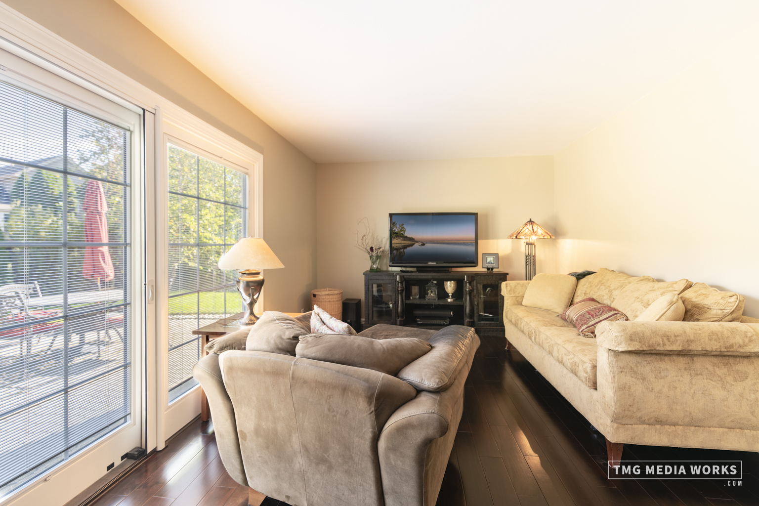 300 Churchill Lane Aurora, IL 60504 - Photo 16 of 30 a living room with furniture a flat screen tv and a floor to ceiling window