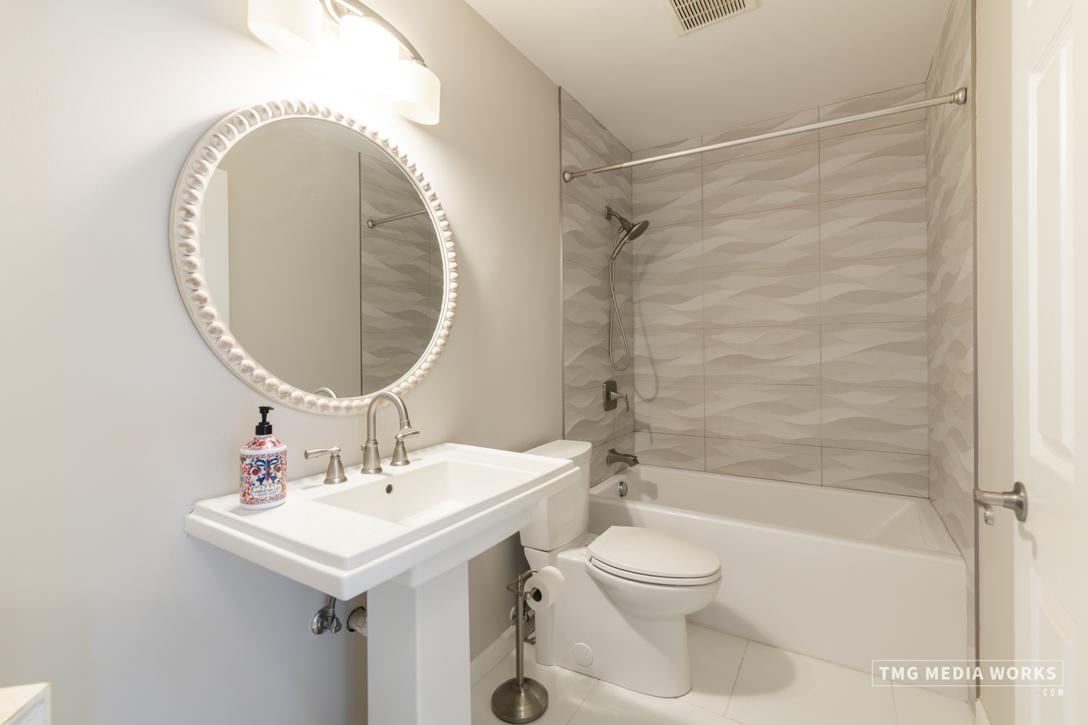 300 Churchill Lane Aurora, IL 60504 - Photo 24 of 30 a bathroom with a sink a toilet and a mirror