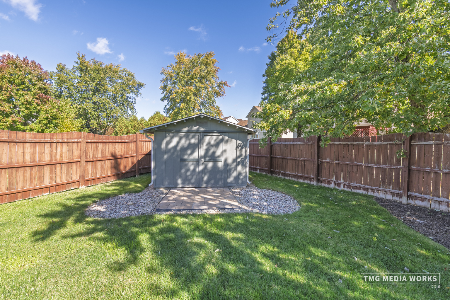 300 Churchill Lane Aurora, IL 60504 - Photo 4 of 30 a view of a backyard with wooden fence and a bench