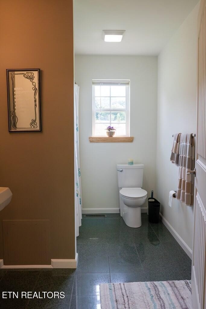 1518 Cummingsville And Sparkman Road Doyle, TN 38559 - Photo 21 of 58 a bathroom with a toilet