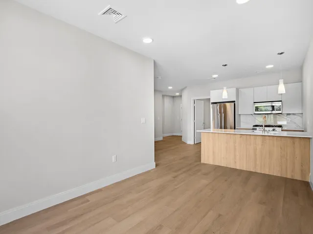 a view of kitchen with wooden floor