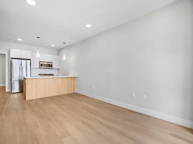 a view of kitchen with wooden floor
