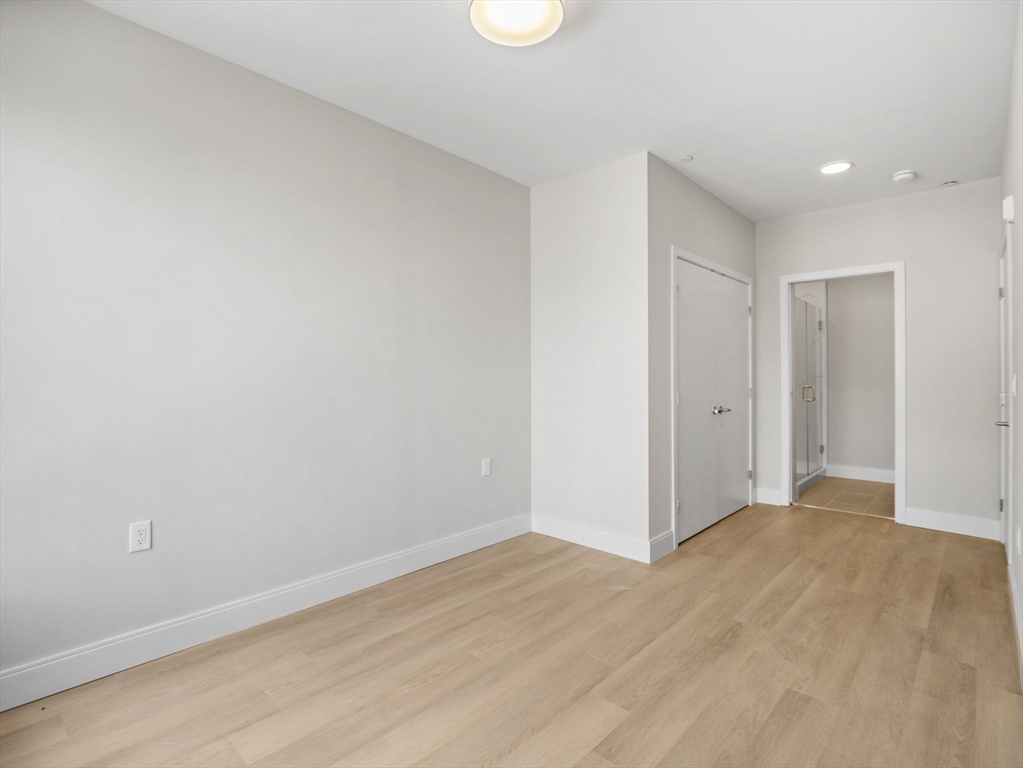 249 Corey Road, Unit 105 Boston, MA 02135 - Photo 23 of 39 a view of hallway with wooden floor