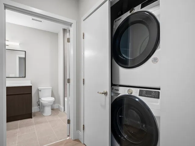 a view of a hallway with washer and dryer