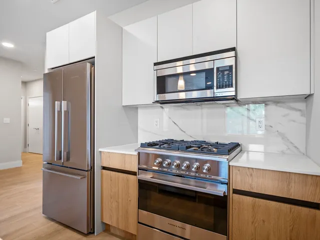 a kitchen with a stove and a microwave