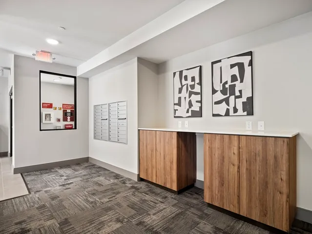 a view of a big room with staircase and closet