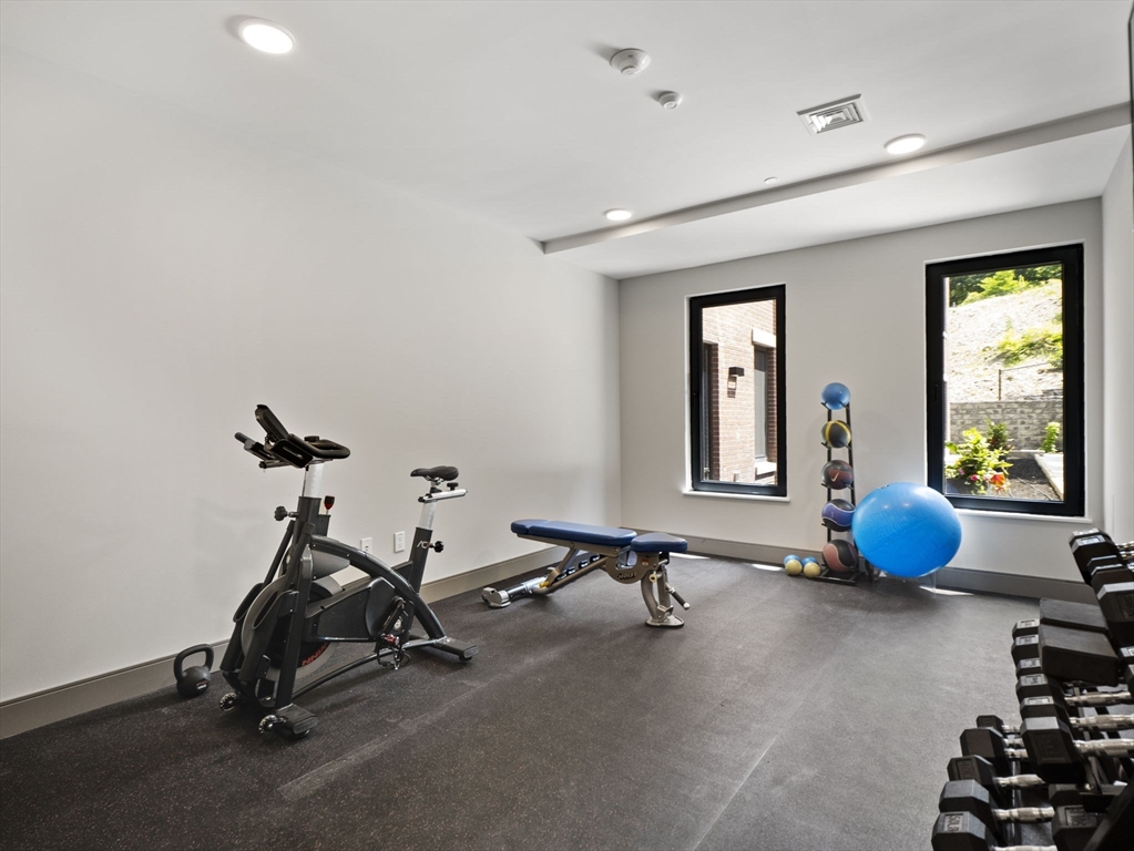 249 Corey Road, Unit 105 Boston, MA 02135 - Photo 32 of 39 a view of a room with gym equipment