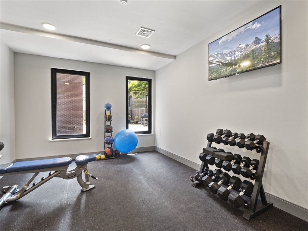 249 Corey Road, Unit 105 Boston, MA 02135 - Photo 33 of 39 a view of room with toys and air hockey table