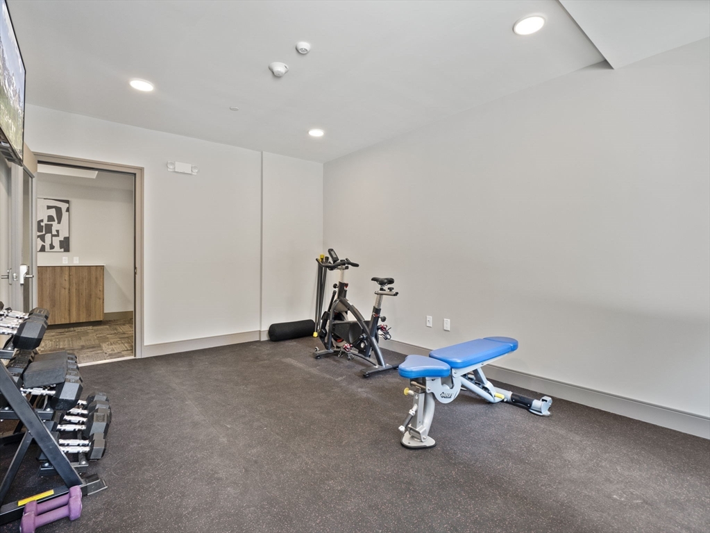 249 Corey Road, Unit 105 Boston, MA 02135 - Photo 34 of 39 a view of a room with gym equipment