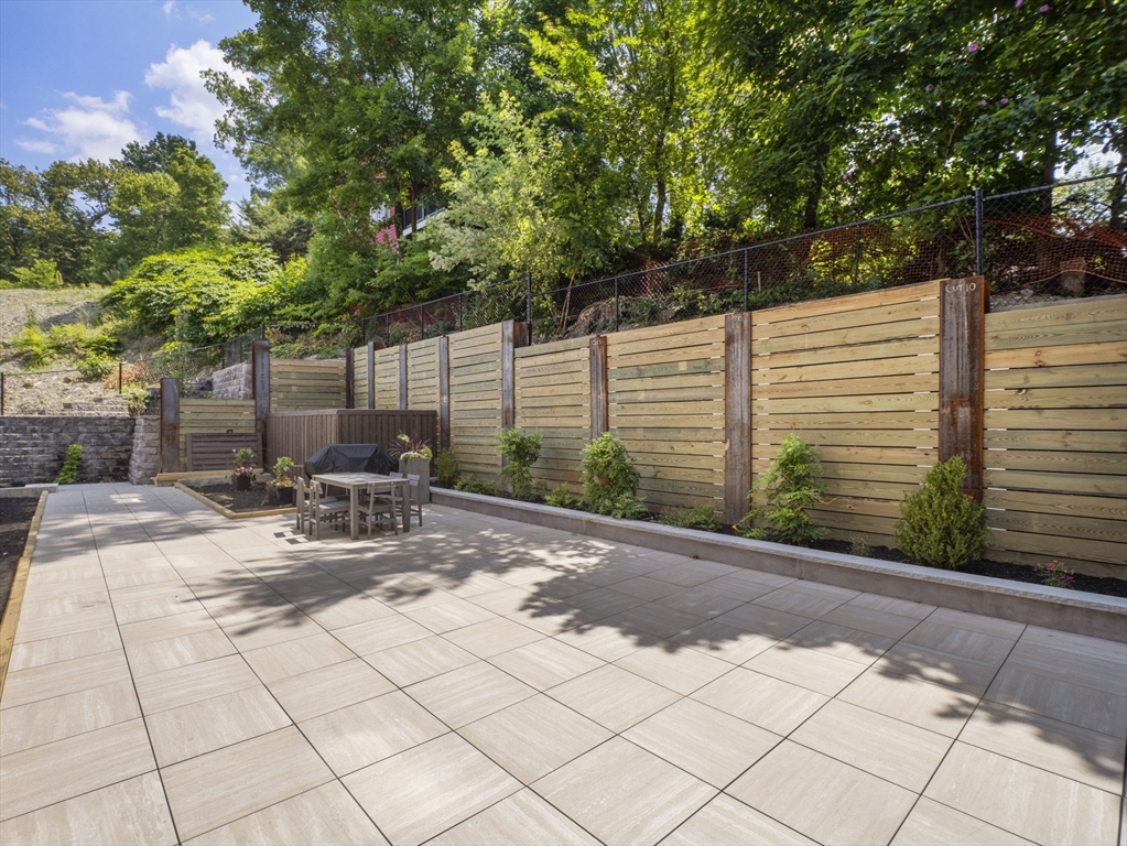 249 Corey Road, Unit 105 Boston, MA 02135 - Photo 38 of 39 a garden view with a seating space