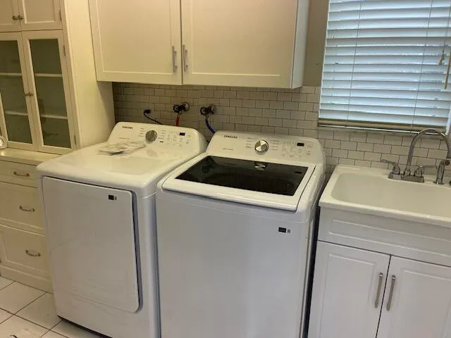 a utility room with dryer and washer