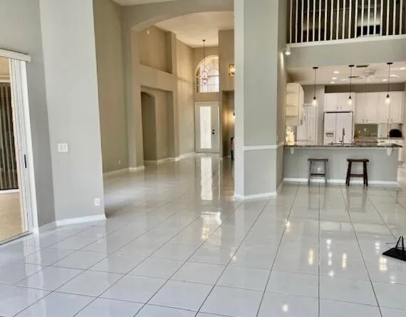 a view of a hallway with seating area