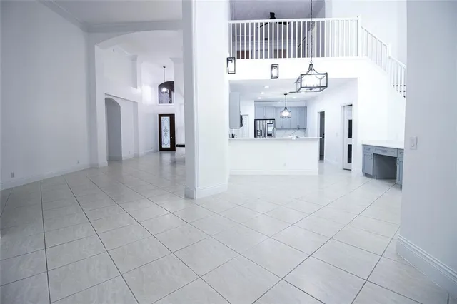 a view of a living room and kitchen with furniture