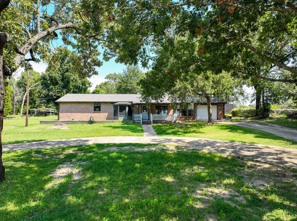 front view of a house with a big yard