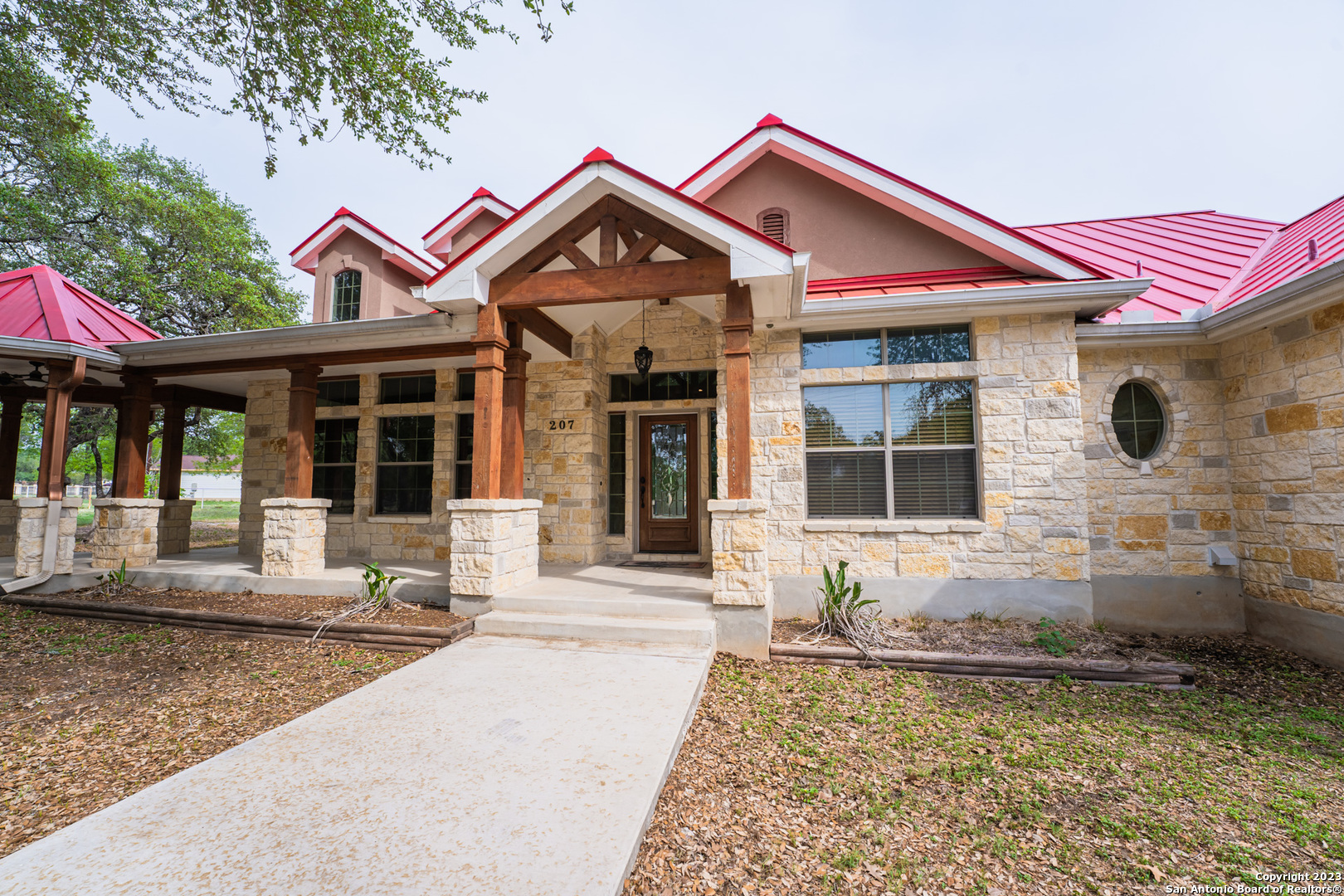 a front view of a house with garden